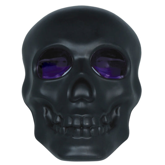 Leuchtender schwarzer Totenkopf mit Rauch