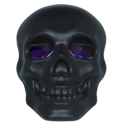 Leuchtender schwarzer Totenkopf mit Rauch